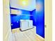 Vibrant laundry room with new washer and dryer and shelving at 2325 Via Bella Blvd, Land O Lakes, FL 34639