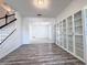 View of living room with white walls and built-in glass-front cabinets at 2325 Via Bella Blvd, Land O Lakes, FL 34639