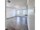 Bright living room with contemporary flooring and built-in desk area at 2325 Via Bella Blvd, Land O Lakes, FL 34639