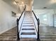 Classic staircase with white risers and dark wood accents creates a focal point at 2325 Via Bella Blvd, Land O Lakes, FL 34639
