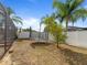 Backyard features a trampoline, white fence, and mature landscaping at 2619 Green Valley St, Valrico, FL 33596