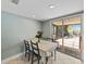 Breakfast nook with sliding glass door leading to outdoor screened-in patio at 2619 Green Valley St, Valrico, FL 33596