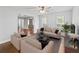 Inviting living room features neutral tones, large windows, and a ceiling fan at 2619 Green Valley St, Valrico, FL 33596
