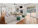 The Living Room, with a fireplace, flows out to the lanai and pool at 2619 Green Valley St, Valrico, FL 33596