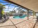 The screened-in pool has a covered lanai and brick paver deck at 2619 Green Valley St, Valrico, FL 33596