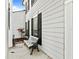A beautiful white bench, with black wrought iron accents, sits on the front porch of this lovely home at 2619 Green Valley St, Valrico, FL 33596