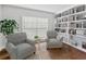 Relaxing sitting room with bright natural light and built-in bookshelves at 2619 Green Valley St, Valrico, FL 33596