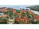 Beautiful aerial view of a waterfront condo community with lush landscaping and stunning water views at 2705 Via Murano # 127, Clearwater, FL 33764
