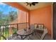 Relaxing balcony features outdoor furniture, fan and view of the community landscaping at 2705 Via Murano # 127, Clearwater, FL 33764