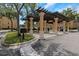 Car care center with covered parking and charging stations near a grassy area under a blue sky at 2705 Via Murano # 127, Clearwater, FL 33764