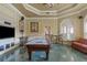 Spacious game room with pool table, television, and stylish decor at 2705 Via Murano # 127, Clearwater, FL 33764