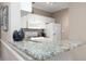 Bright eat-in kitchen boasts granite countertops and all-white appliances for a clean, modern feel at 2705 Via Murano # 127, Clearwater, FL 33764