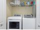 Convenient laundry room with washer, dryer, and storage shelves at 2705 Via Murano # 127, Clearwater, FL 33764