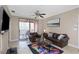 Comfortable living room features access to the balcony, tile floors, and neutral paint at 2705 Via Murano # 127, Clearwater, FL 33764