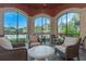 Comfortable poolside seating area with scenic views of the pool and lush landscaping at 2705 Via Murano # 127, Clearwater, FL 33764