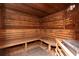 Relaxing sauna room with wooden benches, walls, and ceiling for a luxurious spa experience at 2705 Via Murano # 127, Clearwater, FL 33764