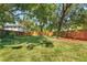Lush backyard showcasing large trees and a secure wooden fence, creating a peaceful outdoor retreat at 2911 N Jefferson St, Tampa, FL 33602