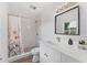 Bright bathroom with a modern vanity, tiled shower, and stylish fixtures at 2911 N Jefferson St, Tampa, FL 33602
