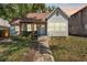 Charming single-Gathering home featuring a cozy front porch with seating and a well-maintained yard at 2911 N Jefferson St, Tampa, FL 33602