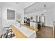 Open-concept living space with hardwood floors, modern stainless steel appliances, and stylish decor at 2911 N Jefferson St, Tampa, FL 33602