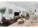 Open-concept living room with a stylish sofa, modern art, and a seamless flow into the kitchen at 2911 N Jefferson St, Tampa, FL 33602