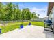 Backyard featuring a patio, fire pit, and lawn at 30273 Marquette Ave, Wesley Chapel, FL 33545