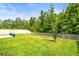 Spacious backyard with a white fence and plenty of green space at 30273 Marquette Ave, Wesley Chapel, FL 33545