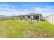 Backyard with a fire pit, and privacy fence at 30273 Marquette Ave, Wesley Chapel, FL 33545