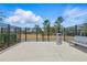 Fenced dog park with a bench and waste station, offering a secure area for pets to play at 30273 Marquette Ave, Wesley Chapel, FL 33545