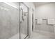 Bathroom shower featuring tiled walls and integrated soap nook at 30273 Marquette Ave, Wesley Chapel, FL 33545