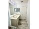 Stylish bathroom with a long vanity, modern lighting, and neutral walls at 3181 Deltona Blvd, Spring Hill, FL 34606