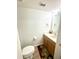 Neat half-bathroom with updated sink, mirror, lighting, and tile flooring at 3181 Deltona Blvd, Spring Hill, FL 34606