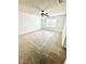 Large bedroom with a ceiling fan and plenty of natural light from the window at 3181 Deltona Blvd, Spring Hill, FL 34606