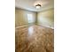 Spacious bedroom featuring tiled floors and a window offering natural light at 3181 Deltona Blvd, Spring Hill, FL 34606