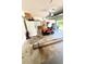 Spacious garage with tools, a riding lawnmower, and ample storage, offering functionality and organization at 3181 Deltona Blvd, Spring Hill, FL 34606