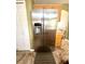 Stainless refrigerator with water dispenser in a kitchen with stainless steel appliances and granite counters at 3181 Deltona Blvd, Spring Hill, FL 34606