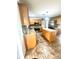 Spacious kitchen featuring an island, granite countertops, stainless appliances, and tile backsplash at 3181 Deltona Blvd, Spring Hill, FL 34606
