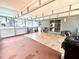 Spacious covered patio with tile flooring, ceiling fan, and access to the backyard, perfect for outdoor living at 3181 Deltona Blvd, Spring Hill, FL 34606