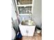 Utility sink with white cabinet, perfect for cleaning and various household tasks at 3181 Deltona Blvd, Spring Hill, FL 34606