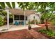 Charming backyard patio featuring cozy seating, beautiful landscaping, and a covered area at 3321 14Th N St, St Petersburg, FL 33704