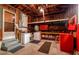 Functional basement space with laundry appliances, workbench, and ample storage solutions at 3321 14Th N St, St Petersburg, FL 33704