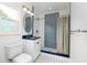 Modern bathroom with blue accents, tiled shower, and vanity at 3321 14Th N St, St Petersburg, FL 33704