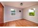 Light-filled bedroom featuring hardwood floors and two windows at 3321 14Th N St, St Petersburg, FL 33704