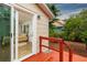Bedroom with sliding glass doors to a red deck, offering serene outdoor access at 3321 14Th N St, St Petersburg, FL 33704