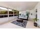 Comfortable sunroom with stylish seating, overlooking a private backyard, perfect for relaxation at 3321 14Th N St, St Petersburg, FL 33704