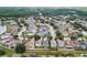 Enjoy this beautiful aerial view of the homes in this suburban neighborhood surrounded by mature trees at 3351 Lintower Dr, Land O Lakes, FL 34638