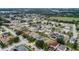 Beautiful aerial view of a quiet neighborhood with tree-lined streets and well-maintained homes at 3351 Lintower Dr, Land O Lakes, FL 34638