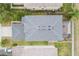 Aerial view of roof featuring architectural shingles, gutters and a screened in patio at 3351 Lintower Dr, Land O Lakes, FL 34638
