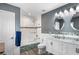 Updated bathroom featuring double sinks, tub with glass and a modern vanity at 3351 Lintower Dr, Land O Lakes, FL 34638