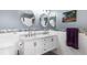 Bathroom with marble countertops, updated lighting, and modern mirrors at 3351 Lintower Dr, Land O Lakes, FL 34638